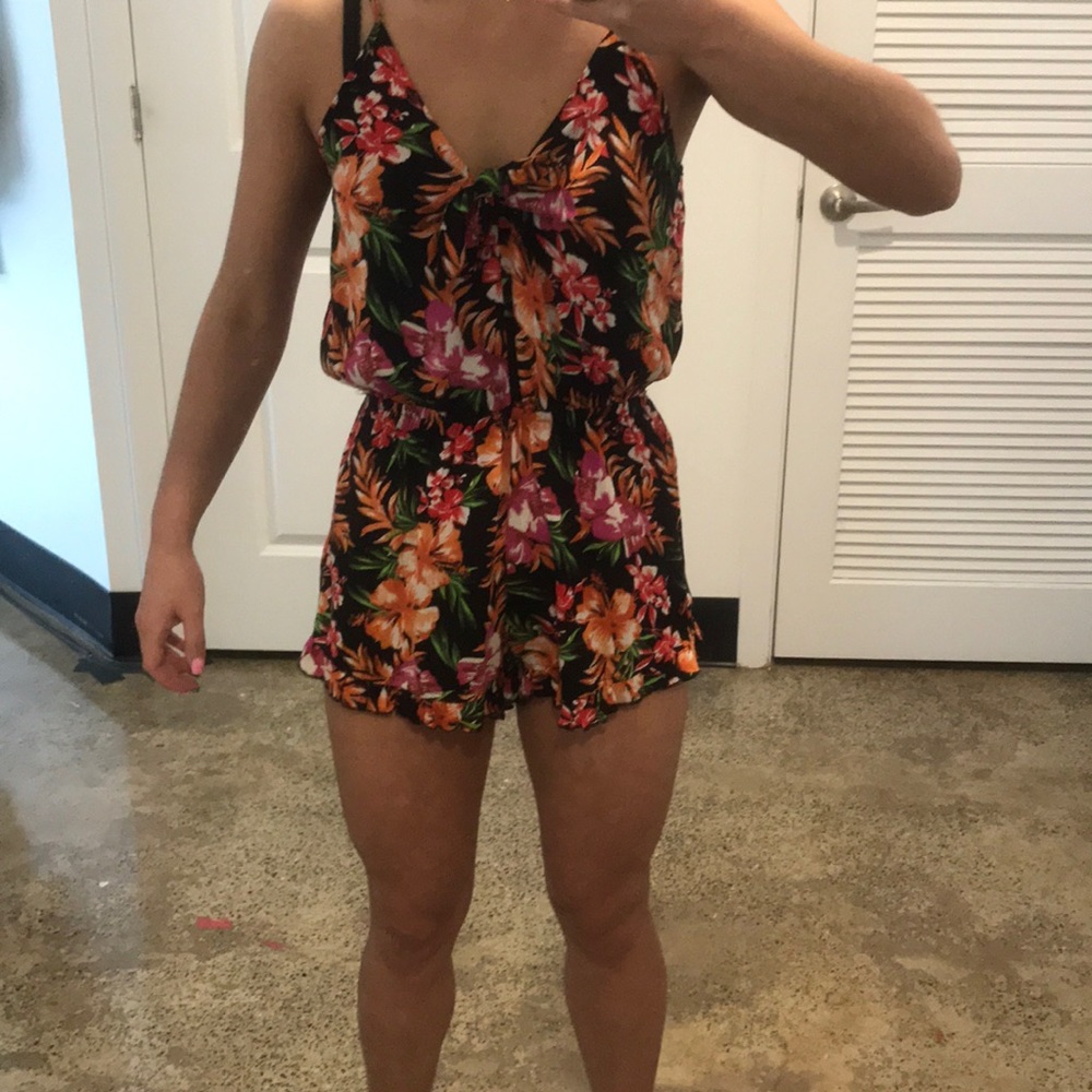 Tropical floral romper. Never worn. NWOT
